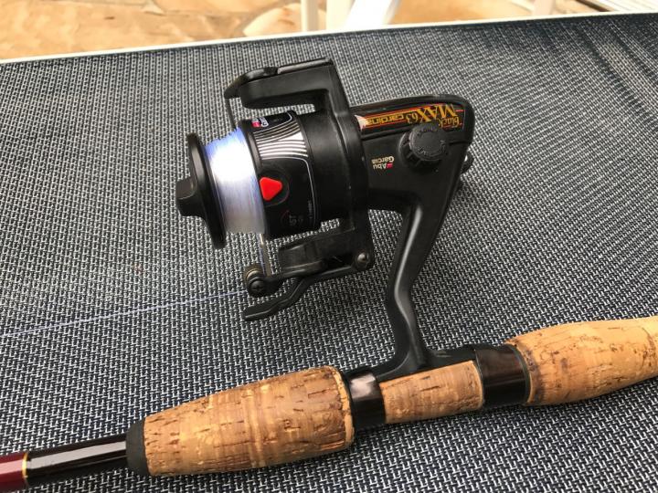 Consumerland - Abu Garcia open face reel and a cork rod